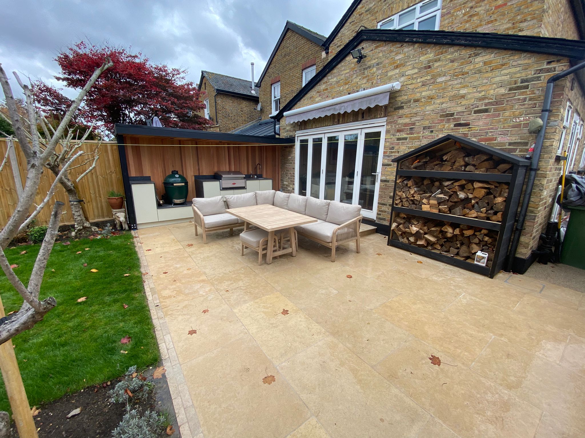 front shot view of repaved patio with outdoor bbq feature